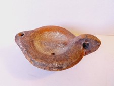 Une lampe à huile en terre