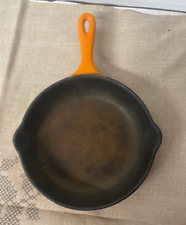Cast iron frying pan made in France le crucible orange dans s juice 