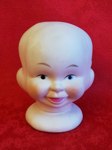 Tête poupée porcelaine - de,