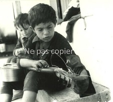 A GYPSY CHILD with his guitar 1964 at Saintes Maries de la Mer
