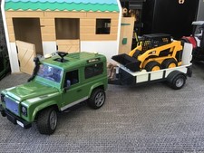 Bruder 1:16 Land Rover Defender with Trailer and CAT Compact Loader.