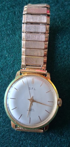 Montre mécanique l - mécanique, s.f.l