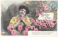 CP BON FETE SMILING WOMAN NEAR TRUNK WICKER FILLED ROSES FLOWERS - 39763
