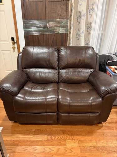 Brown leather loveseat used - leather,
