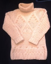 Pul blanc col roulé tricoté