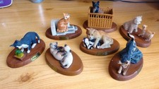 7 figurines de chats,en
