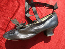 An Antique (19th) Black Leather & Pearl Ball Shoe