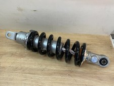 UN AMORTISSEUR ARRIERE MOTO