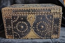 Large Moroccan wooden chest dressed in leather ornate copper and nails early 20th century