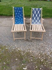 Pair of wooden and fabric lounge chairs