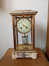 Élégante pendule 4 glaces