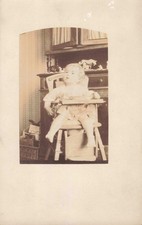 OLD POSTCARD PHOTOGRAPH PHOTO BABY IN HIS HIGH CHAIR