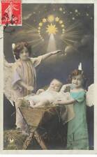 Merry Christmas - Girls wearing angel wings around a baby in a b