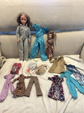 Lot poupées et tenues Bella