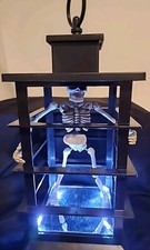 Halloween Prop Skeleton In A Cage Lighted 11"