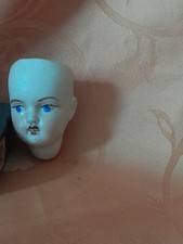 tete de poupee en porcelaine