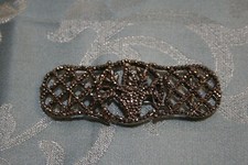 antique metal and marcassite cape or belt buckle, bouquet of flowers