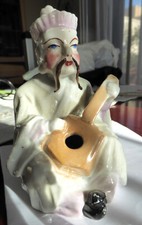 Statuette pique plume en