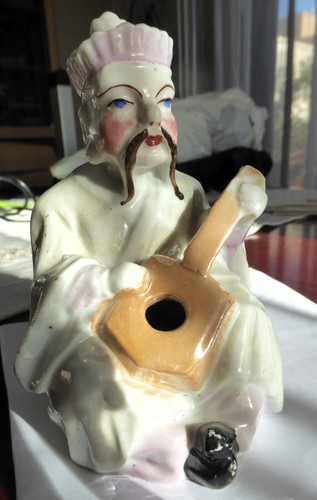 Statuette pique plume - , en