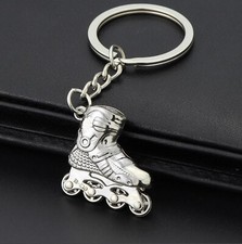 Porte-clés, bijou de sac roller skate, patin a roulette en acier argenté.