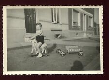 old photo. child . antique toys. wooden horse