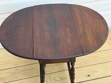 Early 1900 s Antique solid walnut Butterfly Oval Drop Leaf Center Table with i