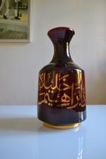 Pied de lampe en céramique à émail bordeaux avec rehauts d'écriture arabe dorés