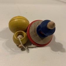 Lot of two wooden spinning tops with AA launcher