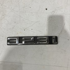 BMW 323i Rear Trunk Lid Emblem 51141869970 NEW NICKS AND DINGS OEM