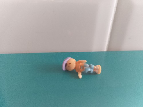 Polly pocket figurine doll