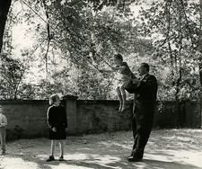 Man pushing children on a swing, must be identified Vintage silver print