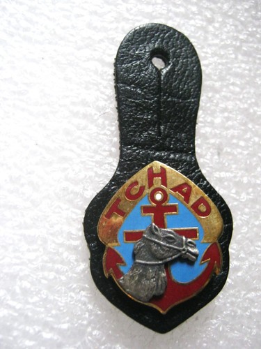 Insigne cuir colonial - cuir, le