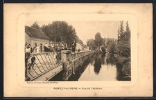 Old postcard Romilly-sur-Seine, Rue de l'Abattoir with bridge and canal 