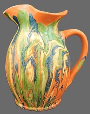 Ancien broc à eau en terre