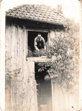 OLD PHOTOGRAPH A MAN AT THE WINDOW OF HIS BARN