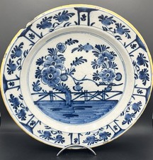 Plat rond creux en faïence de