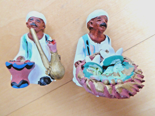 Statuettes marchands en - de,