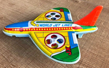 Avion à friction en tôle lithographiée Jouet ancien JX 38  1970 L : 15 cm.