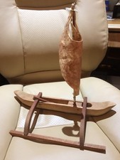 wood canoe with parchment sail