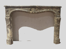 cheminée louis XIV  marbre brèche massif  finement sculptée . XIX siècle .