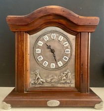 Horloge en bois et étain