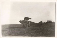 OLD PHOTOGRAPH ANTIQUE PLANE IN A FIELD