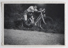 Young woman lying bike - old photo snapshot