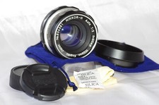 Objectif NF standard 50mm f2 NIKKOR-H, avec bouchons, pare-soleil et housse TBE