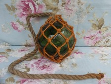 Antique Green Glass Fishing Float with Rope Net - Vintage Marine Decor