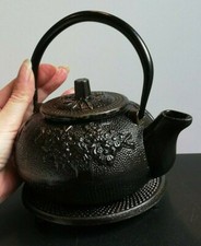 Théière ancienne en fonte 