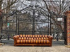 Vintage button tufted leather chesterfield sofa