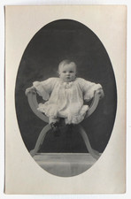 Baby, child on armchair, throne - old studio photo postcard