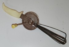 Old manual mixer/kitchen whip.