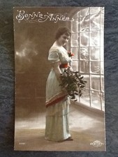 CP GOOD YEAR WOMAN ELEGANT MISTLETOE NEAR GLASS - 34593